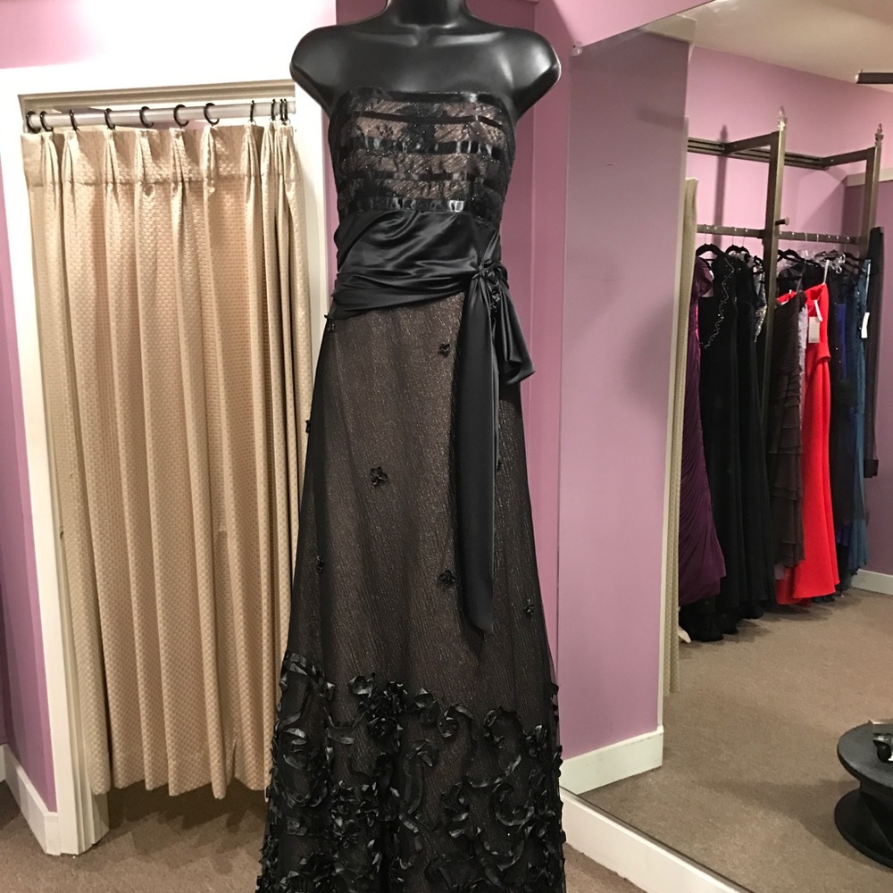 Designer gown by Skinz. Originally $2,900 New
